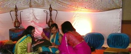 ladies doing wedding henna during sangeet