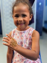 Happy kid with cute henna