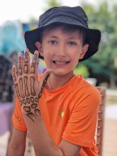 Handsome boy showing henna by Nisha
