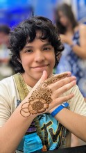 A tech worker showing henna from a corporate event